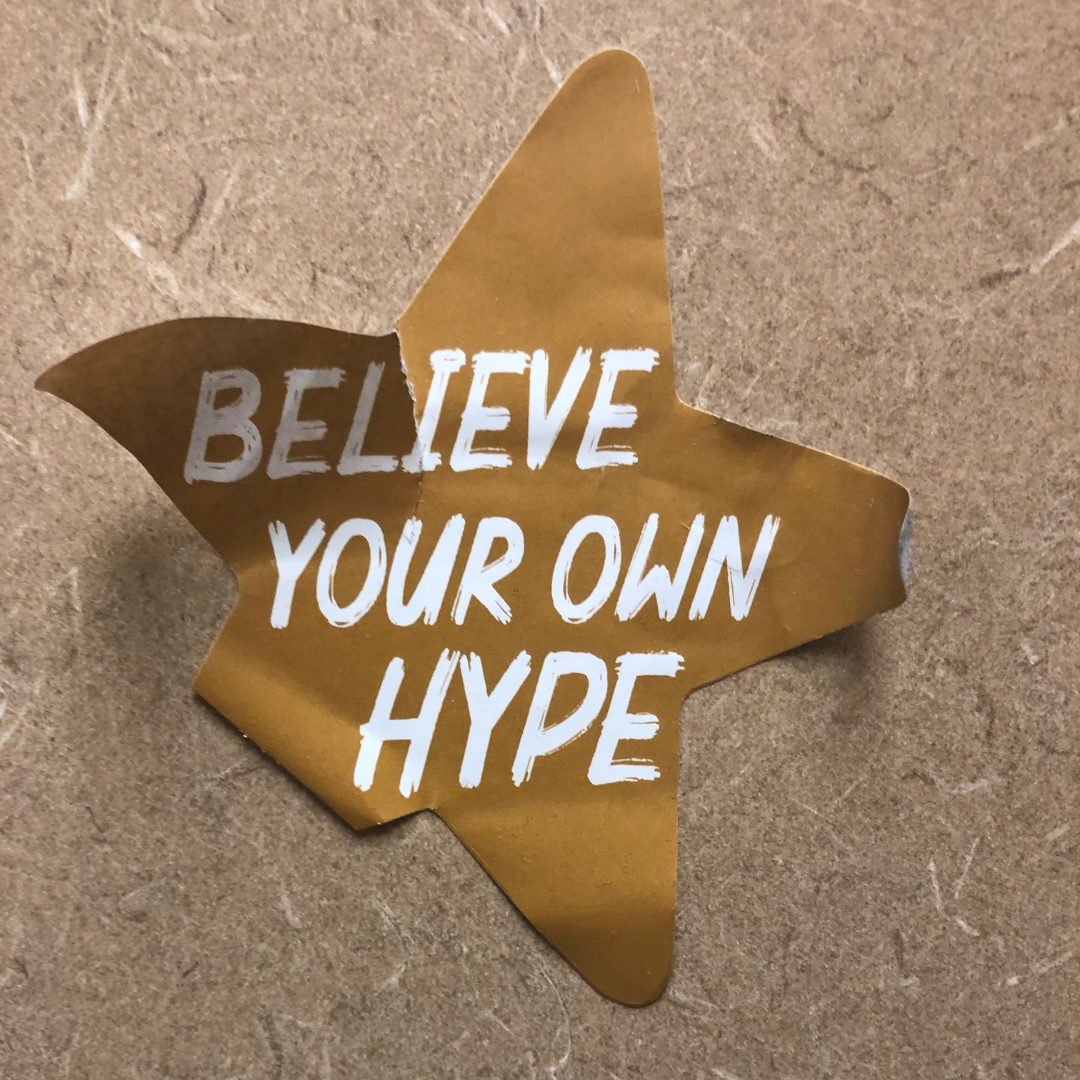 gold star with message "Believe your own hype."