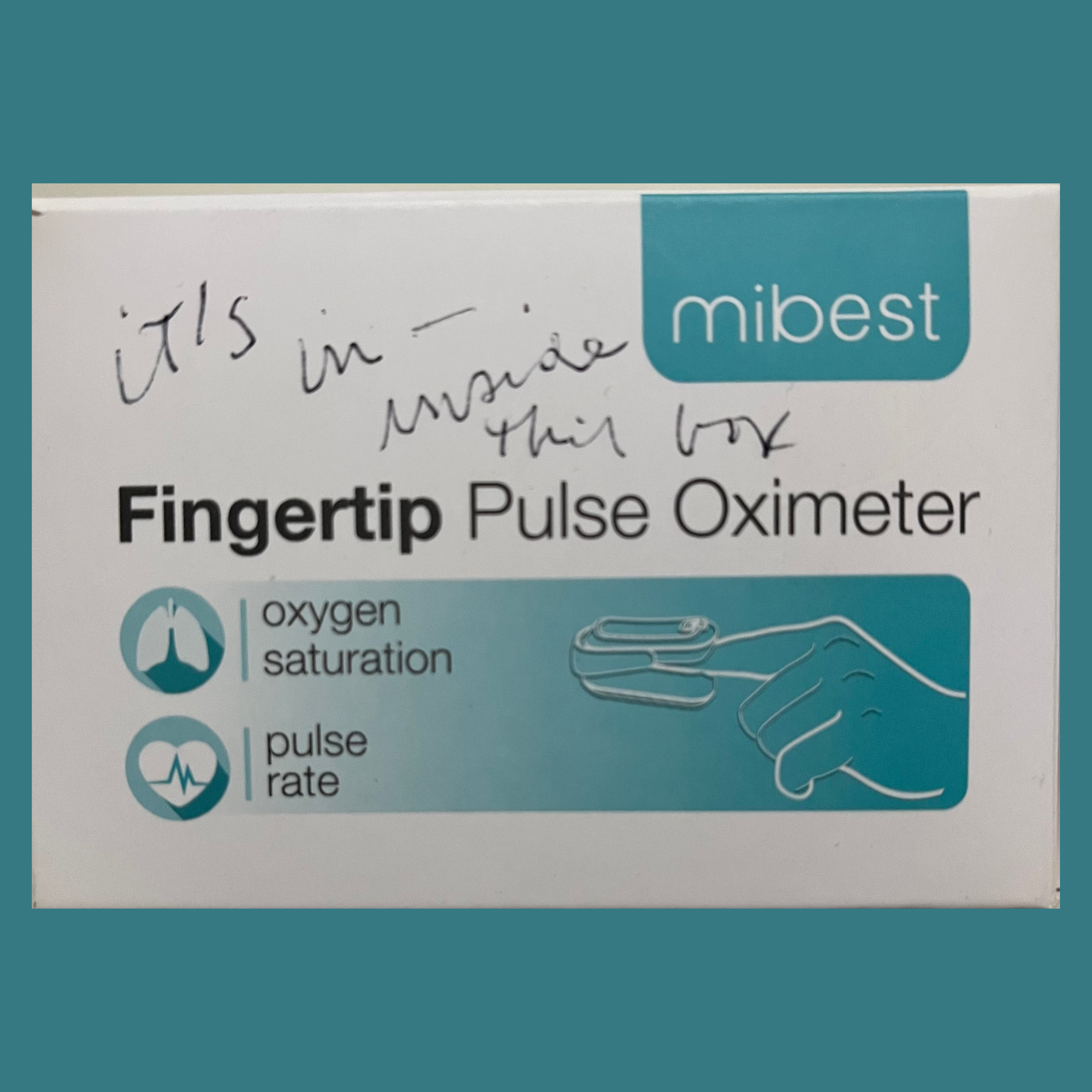 Photo of a box for a fingertip pulse oximeter with the handwritten message: "It's inside this box" 
