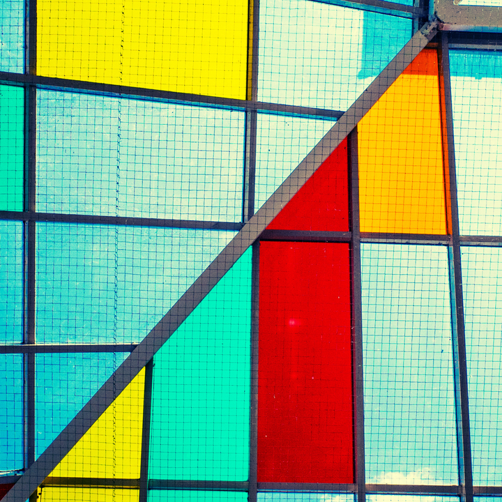 Colorful window panes arranged in a geometric design.